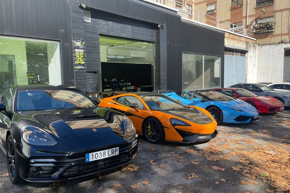 Supercars lined up outside a SkyGloss partner shop